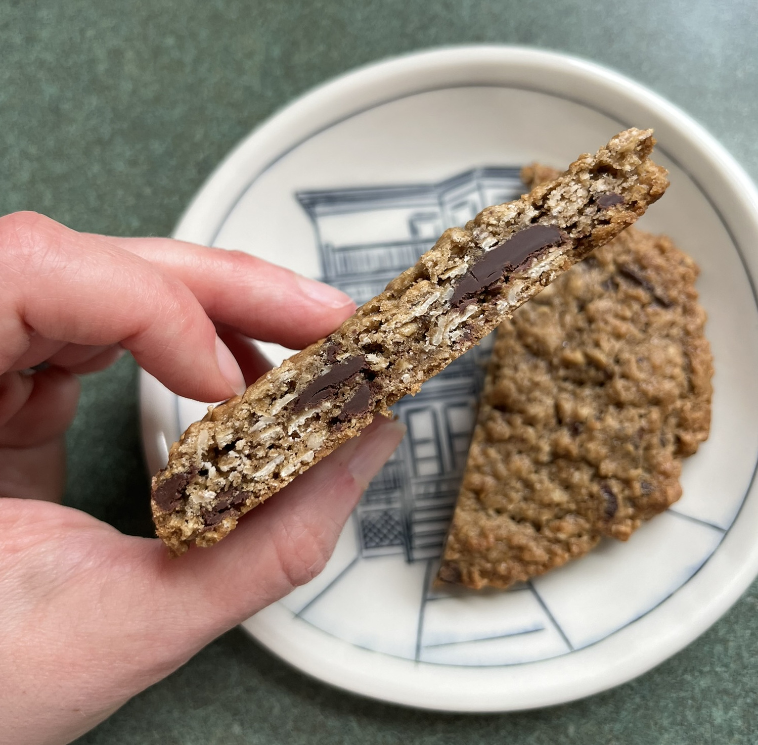 A cross section of the cookie showing delightful layers of oatmeal and chocolate