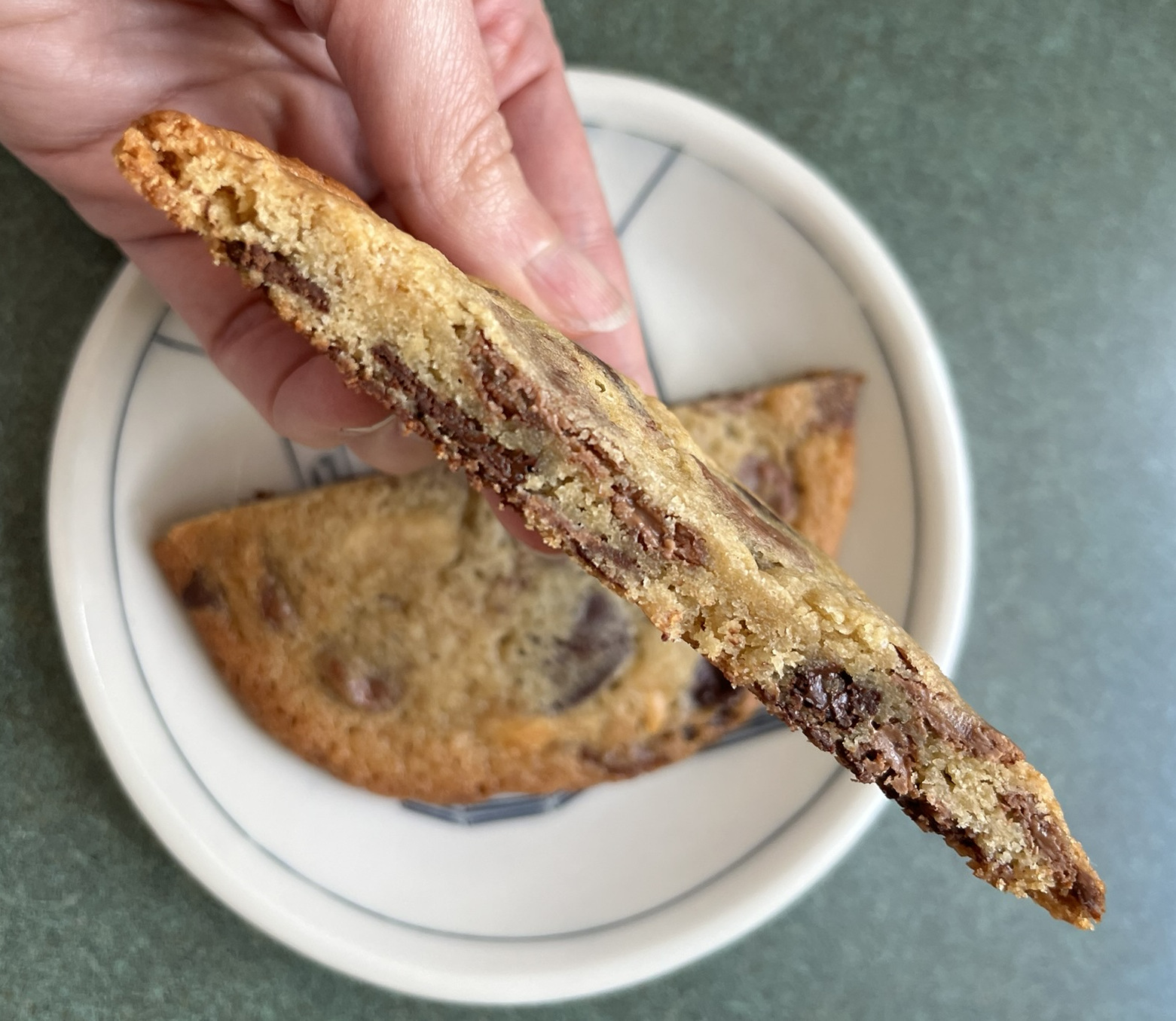 A cross section of a thin cookie with thin wafers of chocolate